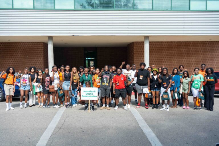 FAMU '28 journalism and public relations scholars gathering in front of SJGC building at orientation with 2024 Orientation Leaders.