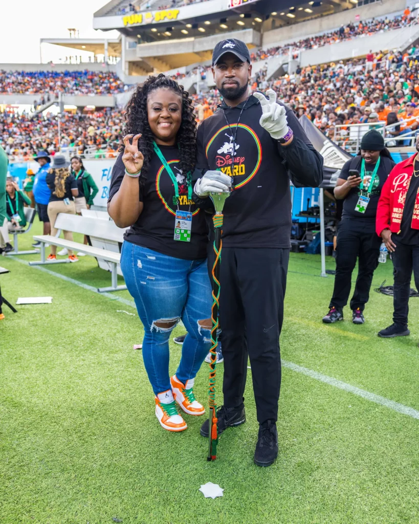 Left to right: Dayna Lee stands with Disney on the Yard drum major Jonathan Boyce at the 2023 Florida Classic. 