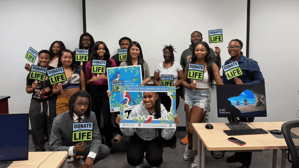 FAMU SJGC Associate Professor Hsuan Huang, Ph.D. (center), celebrates with her students after the success of her class project where students were challenged with developing digital content campaigns to promote organ donation. 