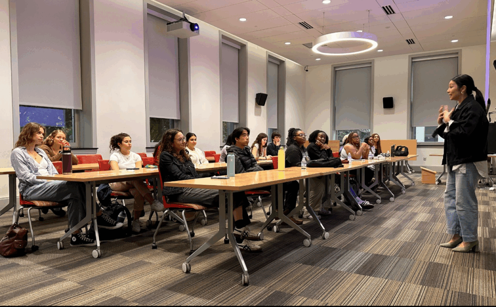 Sears, front row (center), and her classmates listen closely as industry experts share insights during one of PJI’s workshops.  