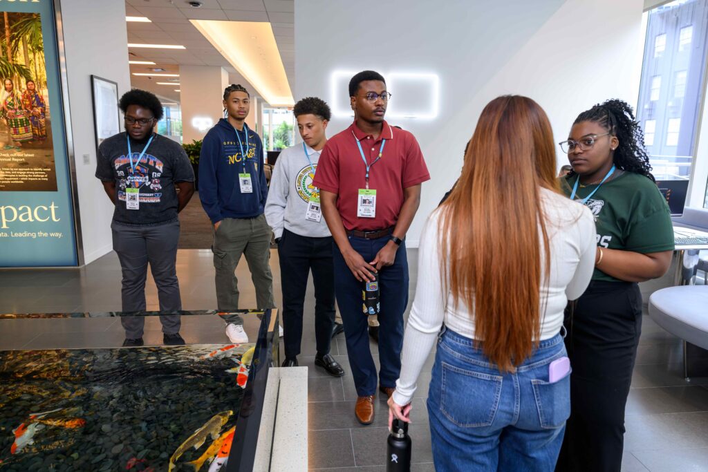 Janelle Sears (far right) tours headquarters with fellow HBCU students and connects with Bloomberg team members during its HBCU Academy of Excellence.
