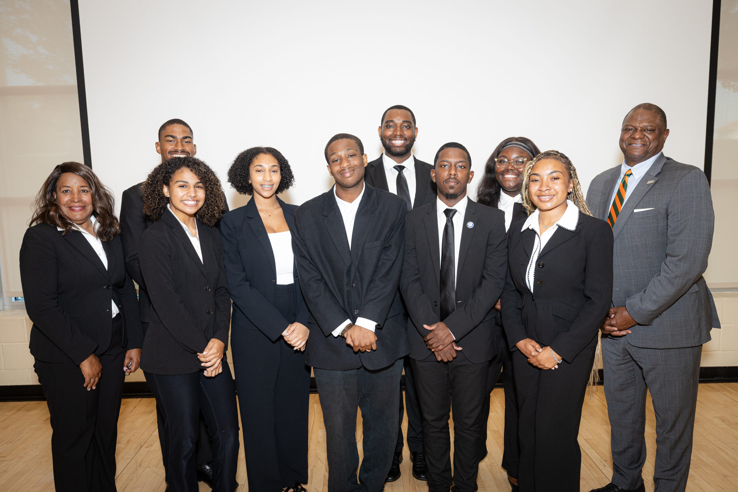 Dr. Doris Roundtree (far left), who leads the Career Exploration Program, celebrates with SJGC interns and former Vice President for University Advancement Dr. Anthony Neal (far right). Interns pictured from left to right (front row): Maricela Carlos-Valentino, Amiracle Baker, Kazon Allen, Michael Trim Jr., and Chloe Waites. Back row: Phillip Woodside and Jarrett Johnson. Photo: Justyn Thomas.