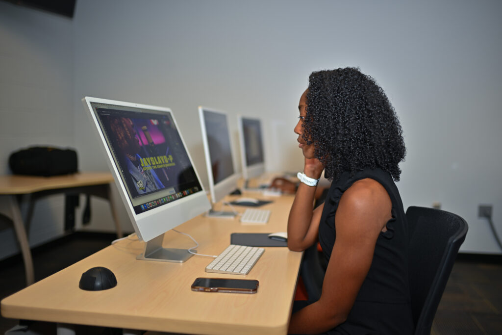 Student editing video.